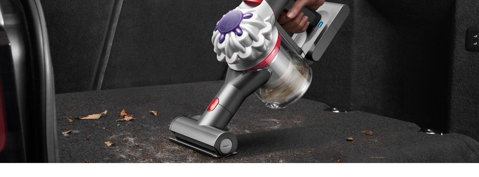 Dyson Car + Boat Vacuum cleaner the back of a car